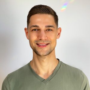 Man, smiling, wearing green t-shirt