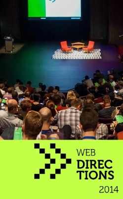 Web Directions Summit 2014 Banner. Shows two seats facing one another on an empty stage