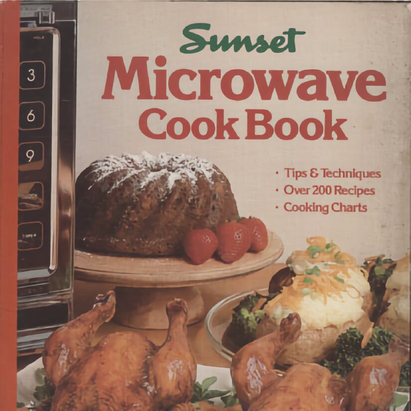 Cover of "Sunset Microwave Cook Book" featuring a bundt cake with strawberries, roasted chickens, loaded baked potatoes, and part of a microwave keypad.
